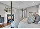 Bedroom featuring a fireplace and a luxurious, comfortable bed with decorative pillows at 2340 Salt Wind Way, Mount Pleasant, SC 29466