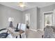 Inviting office with natural light, showcasing a rustic wooden desk and tranquil décor for a productive atmosphere at 2340 Salt Wind Way, Mount Pleasant, SC 29466