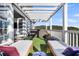 Open-air patio boasts lounge chairs and an inviting hot tub, perfect for relaxation and enjoying scenic views at 2340 Salt Wind Way, Mount Pleasant, SC 29466