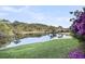 Scenic view of a pond with lush landscaping and trees reflecting in the calm water at 2340 Salt Wind Way, Mount Pleasant, SC 29466