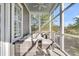 Relaxing screened porch featuring comfortable seating and a scenic view at 2340 Salt Wind Way, Mount Pleasant, SC 29466