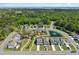 Aerial view of a residential area showcasing lush green spaces and pond at 2823 Dearmin Dr, Mount Pleasant, SC 29466