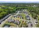 Aerial view of community showing homes, landscaping, pond, and nearby wooded areas at 2823 Dearmin Dr, Mount Pleasant, SC 29466