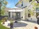 Landscaped backyard featuring a patio with an umbrella, outdoor seating, and green grass at 2823 Dearmin Dr, Mount Pleasant, SC 29466