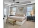 Bright bedroom with natural light, tray ceilings, ceiling fan, and stylish furniture at 2823 Dearmin Dr, Mount Pleasant, SC 29466