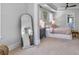 Bright bedroom with natural light, tray ceilings, ceiling fan, and stylish furniture at 2823 Dearmin Dr, Mount Pleasant, SC 29466