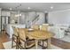 Open dining area adjacent to the kitchen and living room with a light wood table and seating for four at 2823 Dearmin Dr, Mount Pleasant, SC 29466