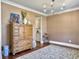 Elegant dining room featuring a classic cabinet, hardwood floors, and stylish decor at 2823 Dearmin Dr, Mount Pleasant, SC 29466