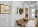 Charming hallway with a rustic bench, artwork, and decorative accents at 2823 Dearmin Dr, Mount Pleasant, SC 29466