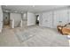 Open hallway with neutral walls and carpets, featuring an ornate rug and a seating chair at 2823 Dearmin Dr, Mount Pleasant, SC 29466