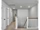 Upstairs hallway with white trim, with multiple doors and access to stairs leading to the lower level at 2823 Dearmin Dr, Mount Pleasant, SC 29466