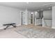 Spacious hallway with neutral walls and carpets, featuring an ornate rug and a bench at 2823 Dearmin Dr, Mount Pleasant, SC 29466