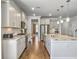 Spacious kitchen featuring an island with seating, stainless steel appliances, granite counters, and white cabinets at 2823 Dearmin Dr, Mount Pleasant, SC 29466