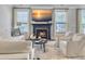 Cozy living room with fireplace, TV, and neutral decor at 2823 Dearmin Dr, Mount Pleasant, SC 29466