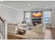 Living room showcasing fireplace, TV, and hardwood floors at 2823 Dearmin Dr, Mount Pleasant, SC 29466
