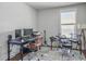 Bright office space featuring a large desk, modern computer setup, and drum set for creative breaks at 2823 Dearmin Dr, Mount Pleasant, SC 29466