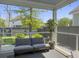 Covered porch with outdoor seating, lush greenery, and views of the surrounding landscape at 2823 Dearmin Dr, Mount Pleasant, SC 29466