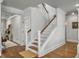 Staircase with wood and white accents, leading to upstairs rooms; hardwood floors and soft lighting at 2823 Dearmin Dr, Mount Pleasant, SC 29466