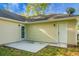 This backyard features a concrete patio and a door providing easy access to the house at 301 Huntington Ct, Hanahan, SC 29410