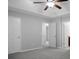 Bright bedroom with a neutral color scheme, featuring a ceiling fan and multiple doors at 301 Huntington Ct, Hanahan, SC 29410