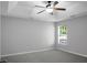 Bedroom features tray ceiling, ceiling fan, large window and neutral colors at 301 Huntington Ct, Hanahan, SC 29410