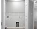A walk-in closet with shelving and connections for laundry machines at 301 Huntington Ct, Hanahan, SC 29410
