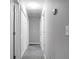 This is a hallway featuring neutral walls and carpet, several doors and access to attic at 301 Huntington Ct, Hanahan, SC 29410