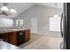 Kitchen with wood cabinets, dark appliances, and a sink under a window at 301 Huntington Ct, Hanahan, SC 29410