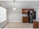 Kitchen featuring dark cabinets, modern appliances, and sleek countertops at 301 Huntington Ct, Hanahan, SC 29410