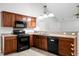 Kitchen showcasing dark cabinets, stainless steel appliances, and modern fixtures at 301 Huntington Ct, Hanahan, SC 29410