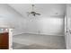 Spacious living room with vaulted ceilings, modern ceiling fan, neutral paint, and plush gray carpeting at 301 Huntington Ct, Hanahan, SC 29410