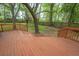 Spacious backyard featuring a wooden deck and mature trees, offering a private outdoor space at 306 Fairlawn Drive, Moncks Corner, SC 29461