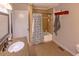 Well-lit bathroom featuring granite countertops, a tub, and a decorative shower curtain at 306 Fairlawn Drive, Moncks Corner, SC 29461