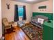 Charming bedroom with playful decor, a crib, and comfortable seating, creating a cozy and inviting space at 306 Fairlawn Drive, Moncks Corner, SC 29461