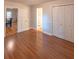 Comfortable bedroom with hardwood floors, ample closet space, and neutral decor for a relaxing retreat at 306 Fairlawn Drive, Moncks Corner, SC 29461