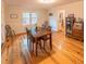 Bright dining room with wooden table and chairs, hardwood floors, and ample natural light at 306 Fairlawn Drive, Moncks Corner, SC 29461