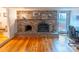 Cozy fireplace with brick surround and access to outdoor space, enhancing the interior living space at 306 Fairlawn Drive, Moncks Corner, SC 29461