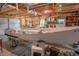 Garage interior featuring ample storage and a boat project, showcasing the space's potential at 306 Fairlawn Drive, Moncks Corner, SC 29461