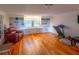 Versatile living area featuring built-in shelving and hardwood floors, ideal for entertainment or relaxation at 306 Fairlawn Drive, Moncks Corner, SC 29461