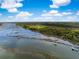 Sweeping aerial view of docks stretching into the water, highlighting a vast and beautiful landscape at 3060 Bohicket Rd, Johns Island, SC 29455
