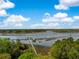 Scenic aerial view of the property featuring a private dock and access to tranquil waters at 3060 Bohicket Rd, Johns Island, SC 29455
