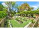 Beautiful backyard with flower beds, greenery, and a charming shed for fresh cut flowers at 3060 Bohicket Rd, Johns Island, SC 29455