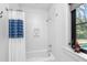 Bathroom with white subway tile, tub and niche for toiletries at 3060 Bohicket Rd, Johns Island, SC 29455