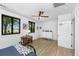 Bright bedroom with two windows, ceiling fan and a white dresser at 3060 Bohicket Rd, Johns Island, SC 29455