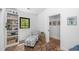 Bedroom with brick flooring, chaise lounge and a black-framed window overlooking the outdoors at 3060 Bohicket Rd, Johns Island, SC 29455