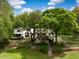 Stunning home exterior with lush landscaping, a swimming pool, and a charming walkway leading to the entrance at 3060 Bohicket Rd, Johns Island, SC 29455