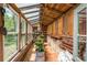 Greenhouse interior with potting supplies and plants at 3060 Bohicket Rd, Johns Island, SC 29455