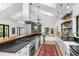 Bright, open kitchen features a vaulted ceiling, professional-grade appliances, and ample counter space at 3060 Bohicket Rd, Johns Island, SC 29455