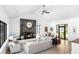 Bright living room featuring modern fireplace, light wood floors, and seamless transition to outdoor views at 3060 Bohicket Rd, Johns Island, SC 29455