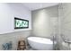 Contemporary bath with soaking tub, rain shower, tiled walls and accent window with stained glass at 3060 Bohicket Rd, Johns Island, SC 29455